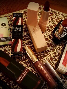 Set of Seven Brown Lipsticks with hints of dark red. Includes pencil & sample.